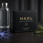 A premium packed box of Maxi2 longevity supplement on a dark wooden desk representing neuro-metabolic recovery and brain energy.